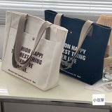 black gift bag with ribbon and flower-535354442
